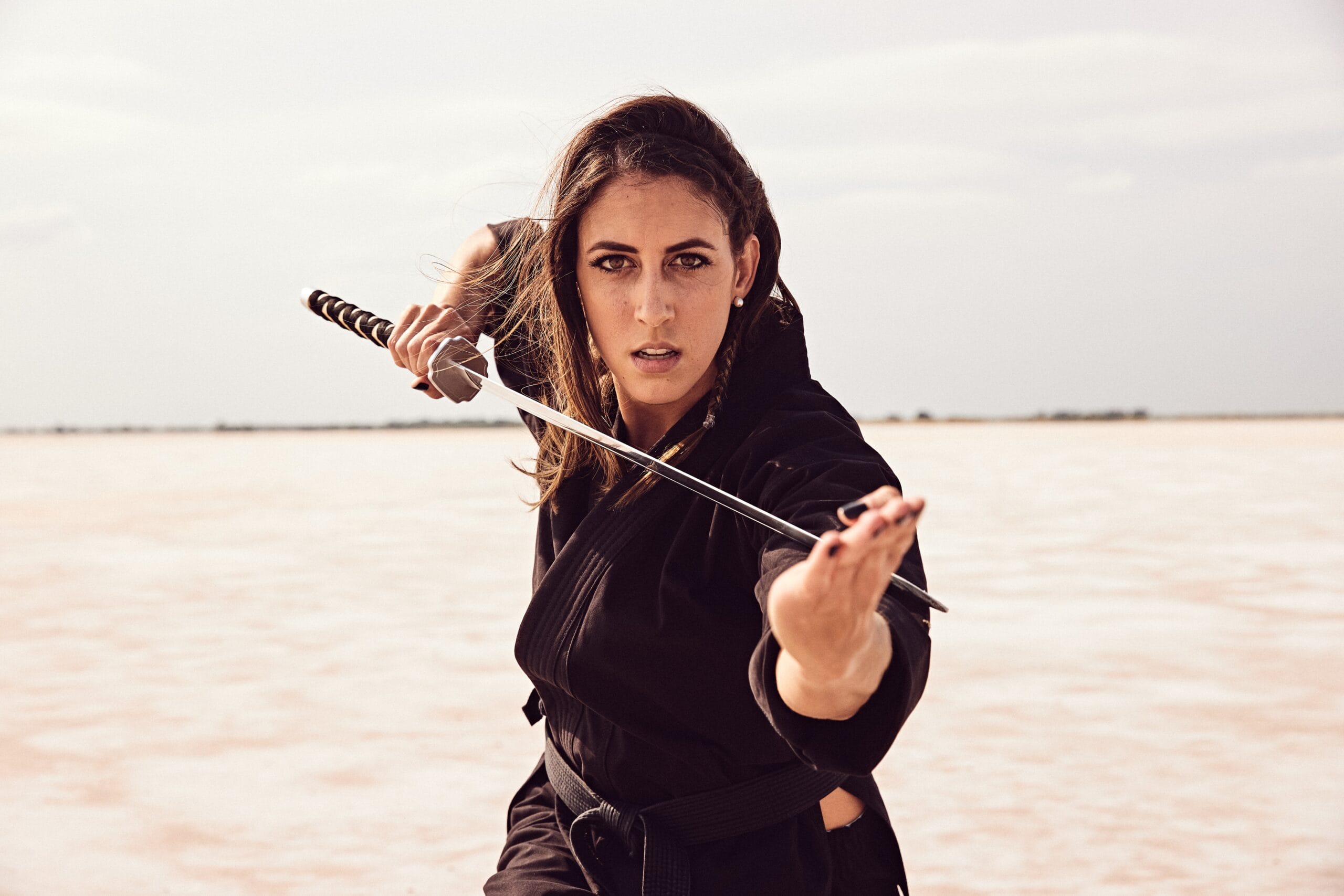 caitlin-dechelle-professional-actress sword image Caitlin Dechelle Professional Actress Sword Image | Fighting Arts Health Lab
