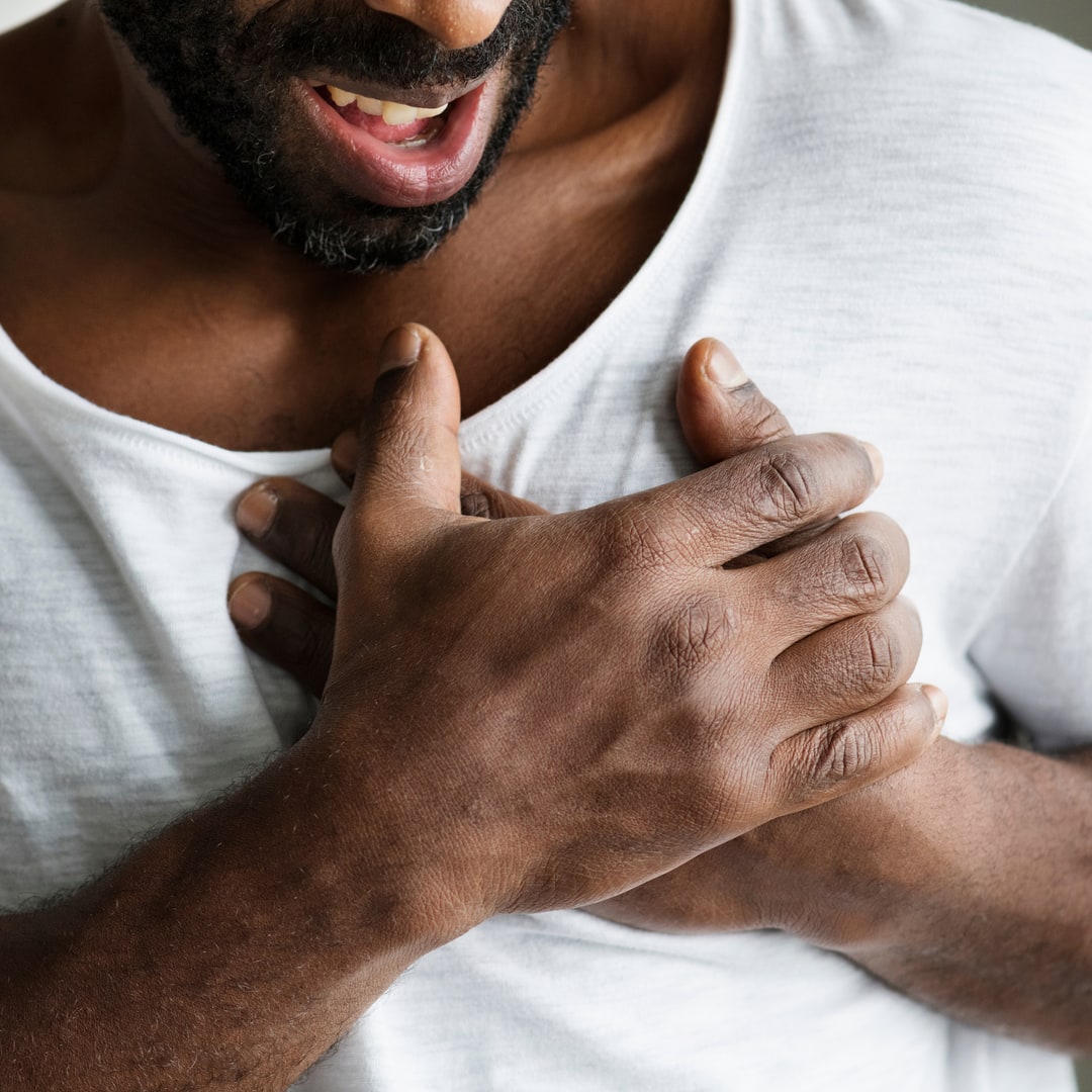 Chest Injuries Man Holding Chest | Fighting Arts Health Lab