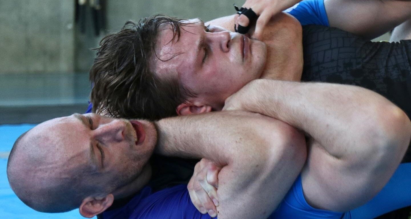 BJJ athlete demonstrating rear naked choke