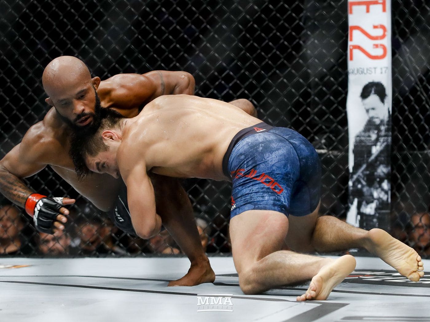 MMA fighter demonstrating versatility through combined wrestling takedown defense while preparing a counterstriking technique MMA fighter demonstrating versatility through combined wrestling takedown defense while preparing a counterstriking technique