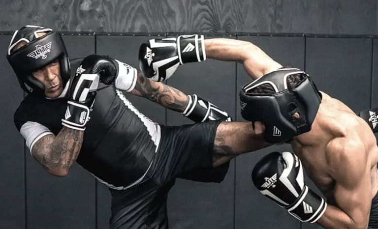 New MMA student receiving fundamental instruction from coach, highlighting the importance of proper guidance from the beginning New MMA student receiving fundamental instruction from coach, highlighting the importance of proper guidance from the beginning